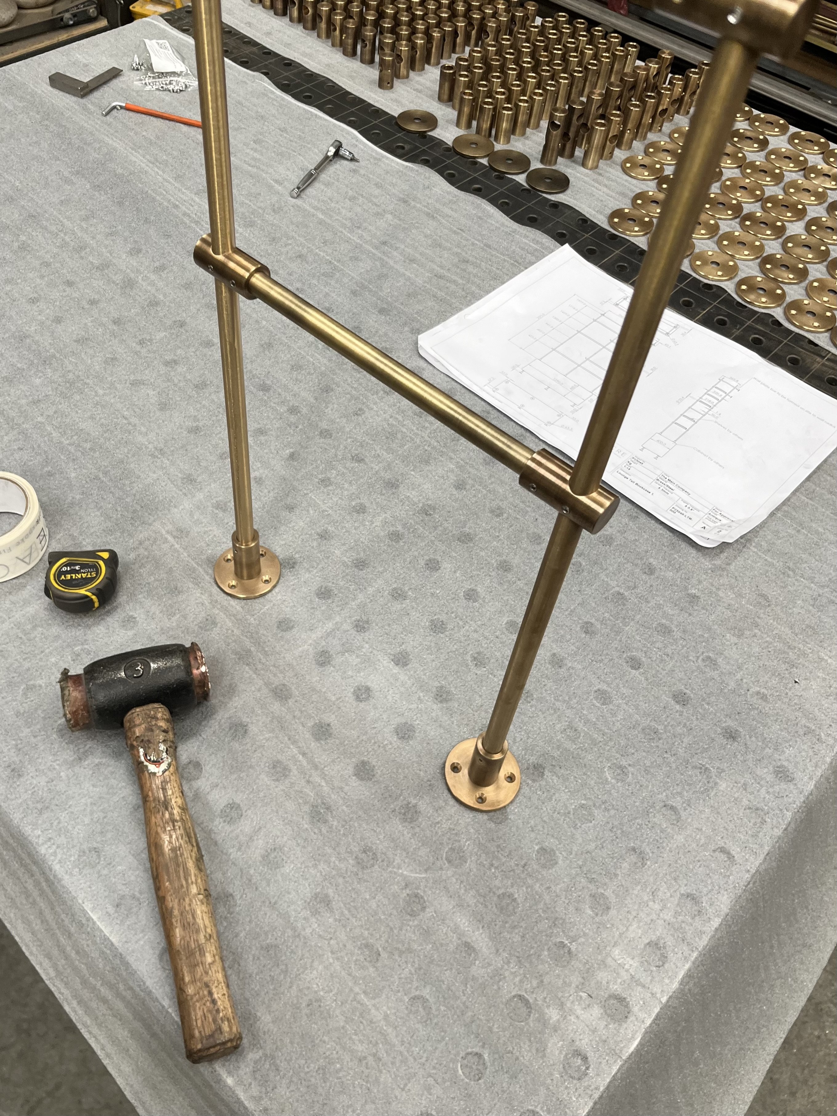 Custom brass handrail crafted in our workshop