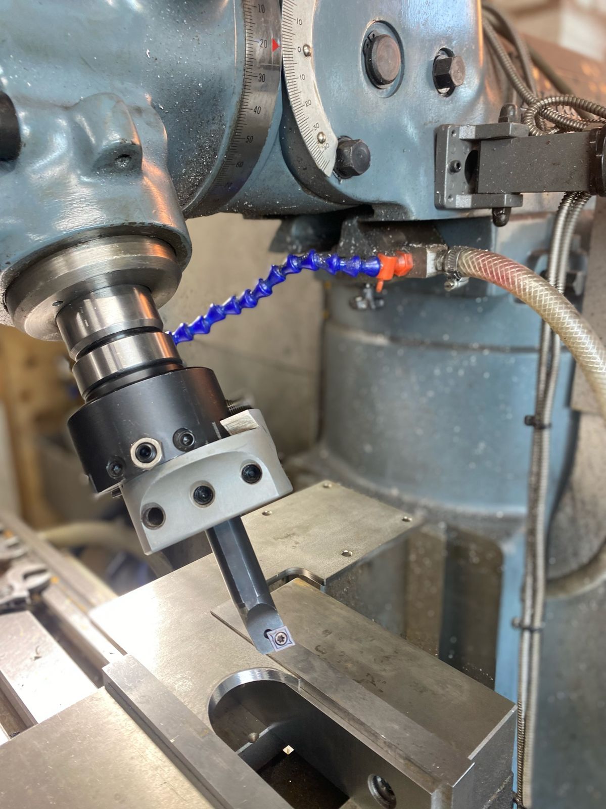 A brass part being milled