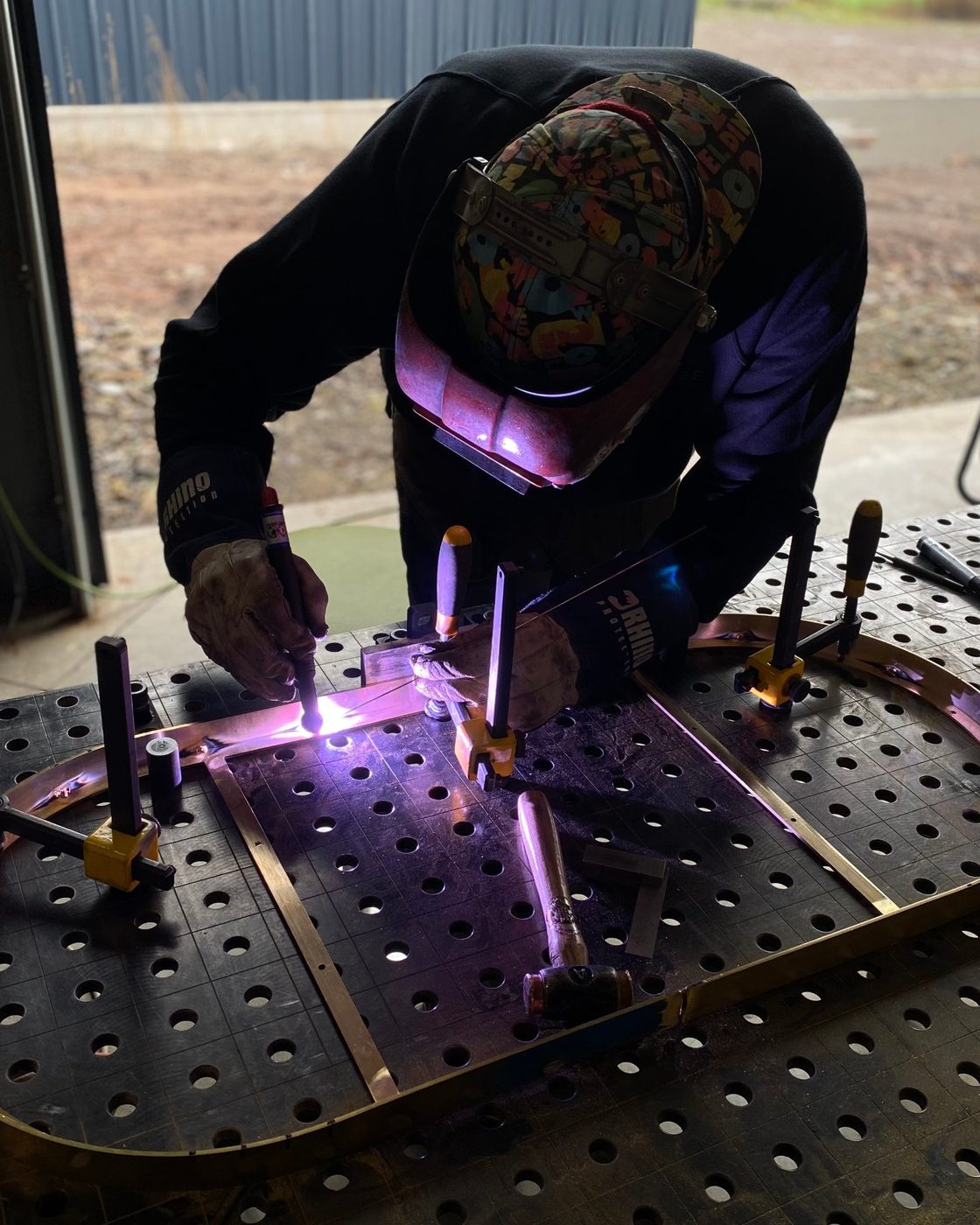 Welding a brass frame in our Staffordshire workshop